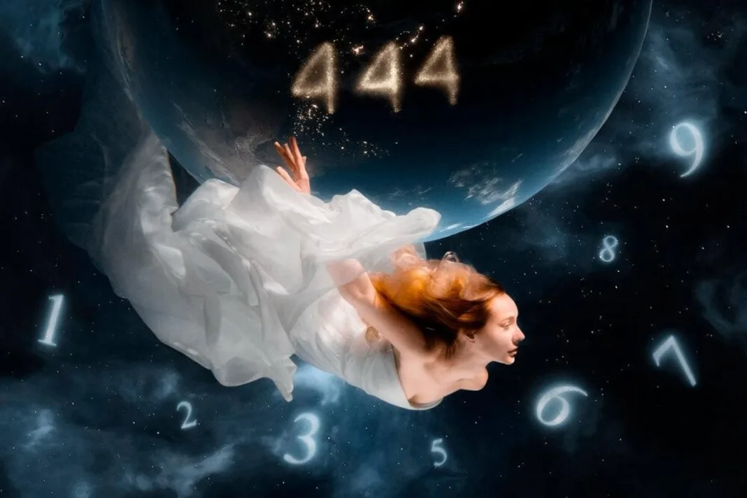 A woman in a flowing white dress floating in space surrounded by glowing numbers, with the angel number 444 shining above Earth, symbolizing manifestation and spiritual guidance.