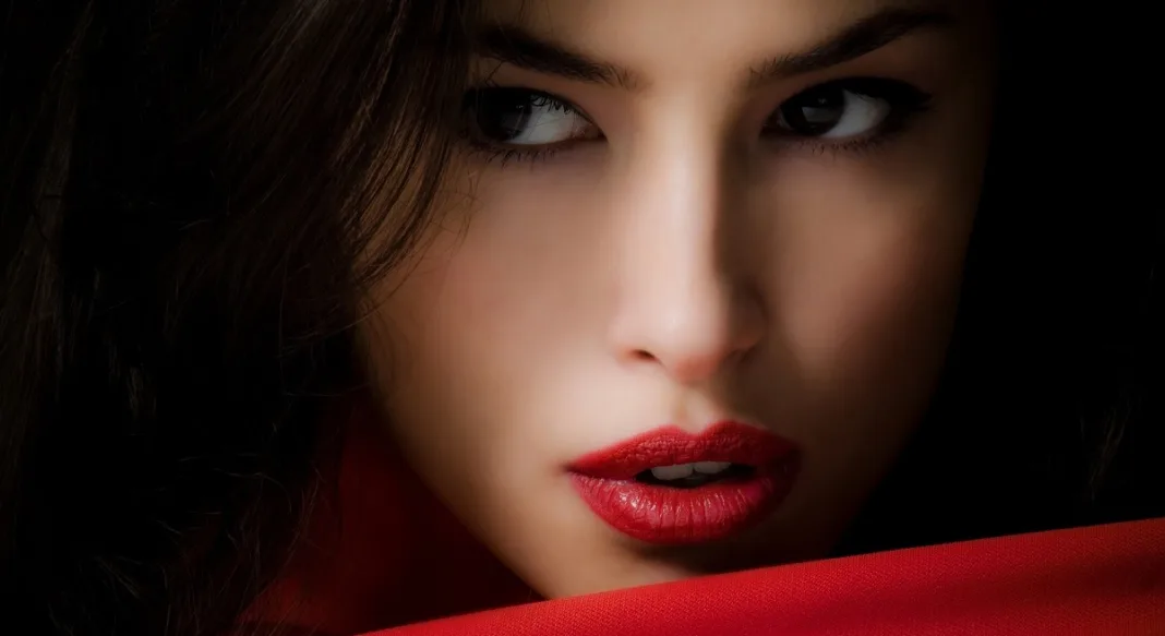 Person with dark hair and red color